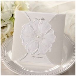 Classic trifold card printed in customisable calligraphic lettering enclosed in a sophisticated silk screened pocket with an embossed flower adorned with a shiny pearl
